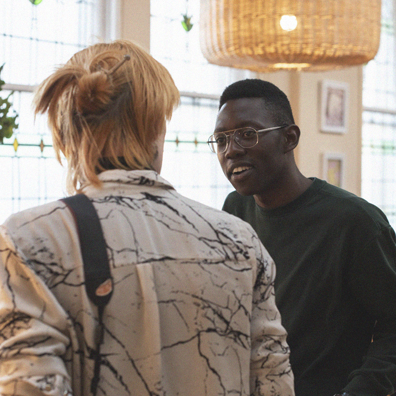 Two students chat at a networking event